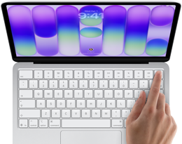MacBook Neo, warna silver, menampilkan layar masuk, jari seseorang pada sensor Touch ID di sudut kanan atas keyboard